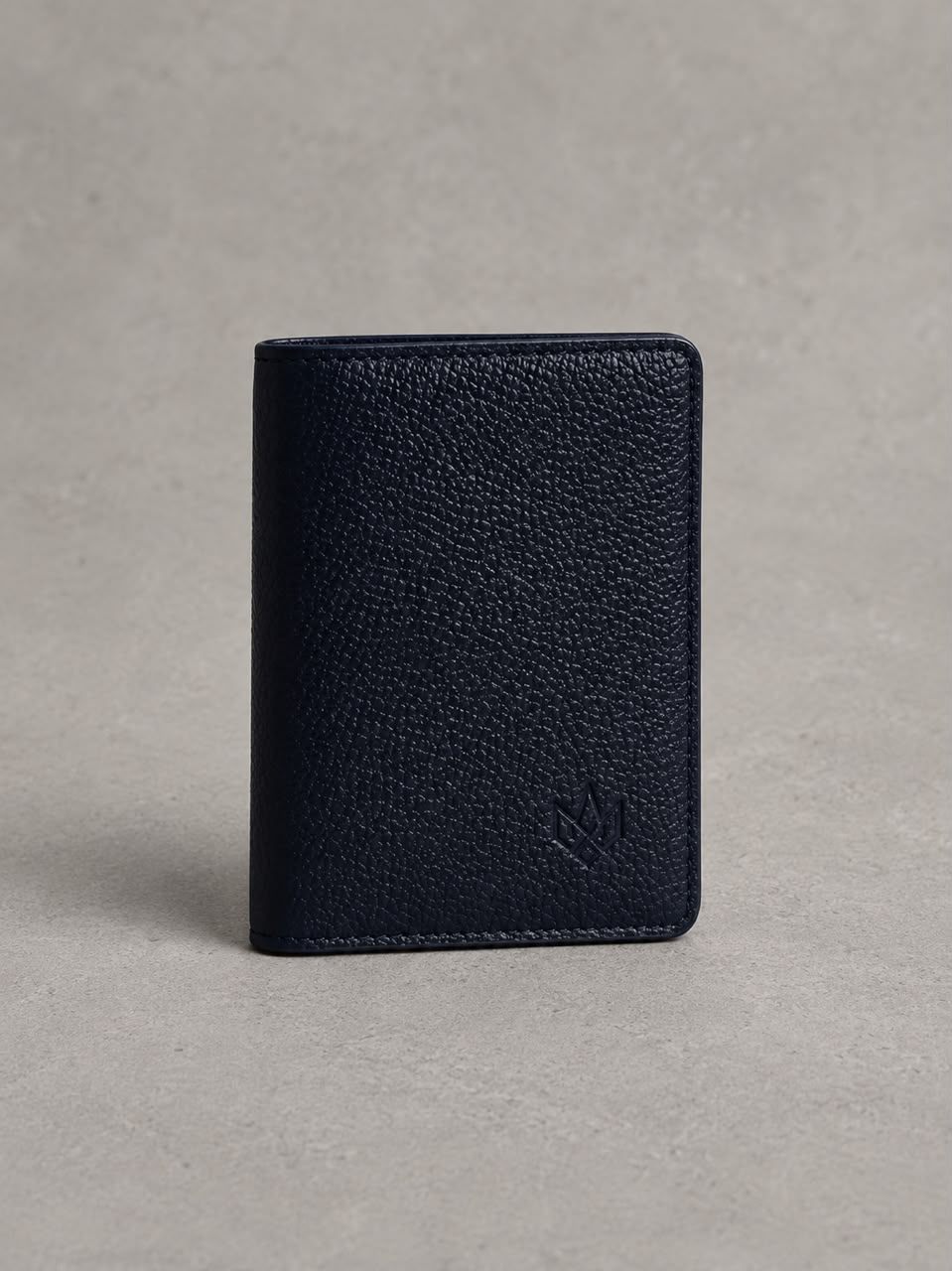 The Passport Holder — held in hand, close crop